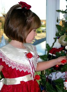 Child and Christmas tree